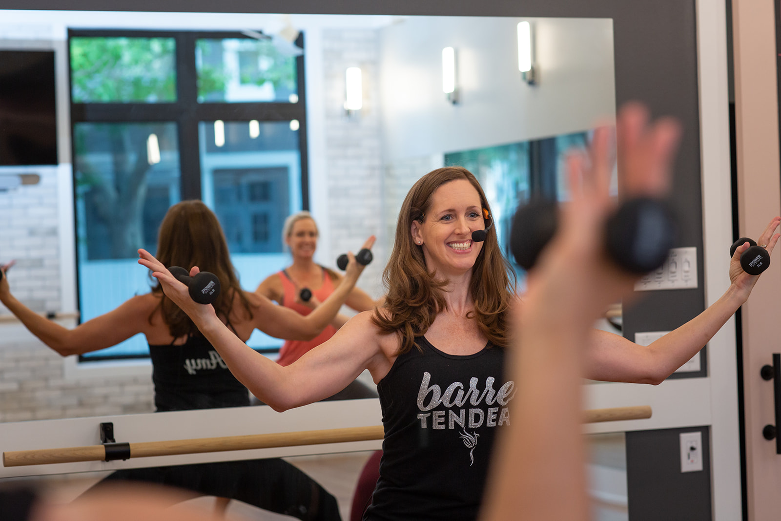 gym owner leading barre class for branding photos
